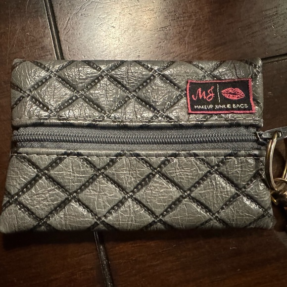 Makeup Junkie Handbags - EUC Makeup Junkie leather Quilted Gray Micro Makeup Bag